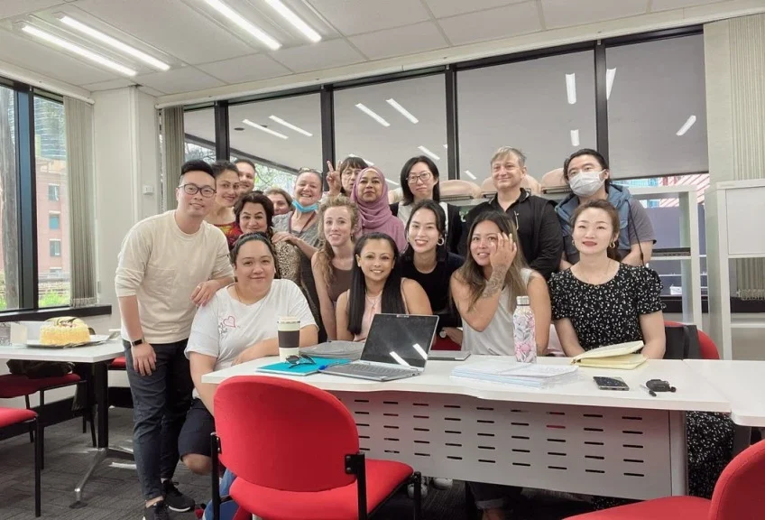 Happy group of international students in classroom